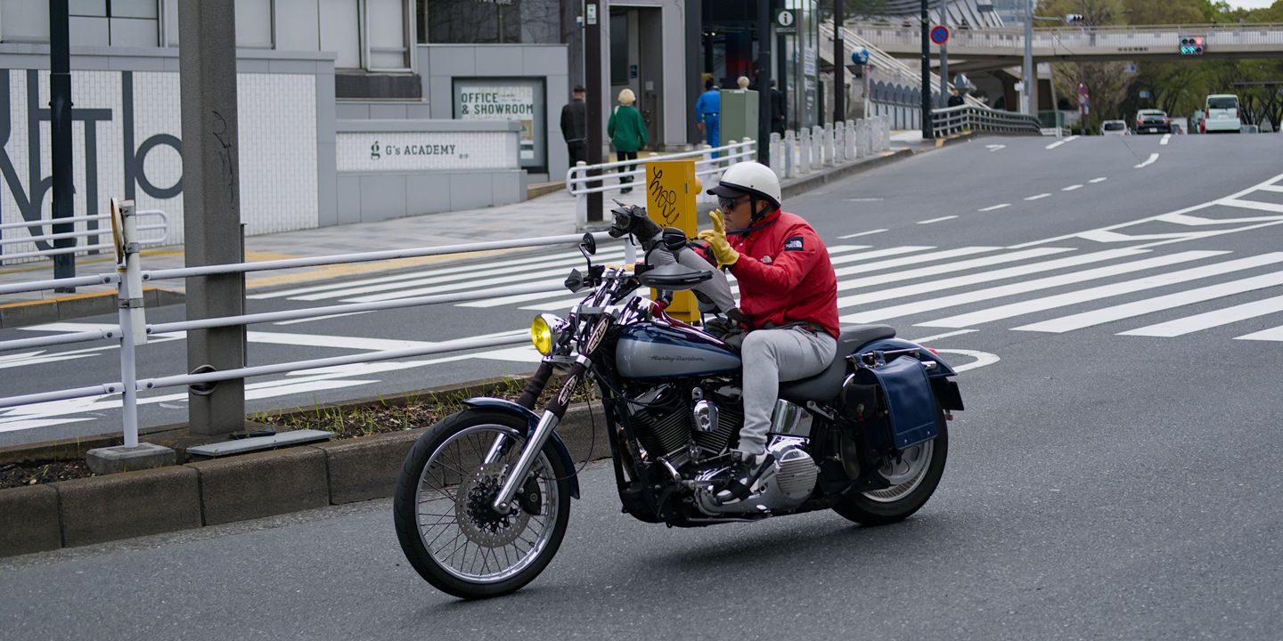 Man on bike with a dog on his lap