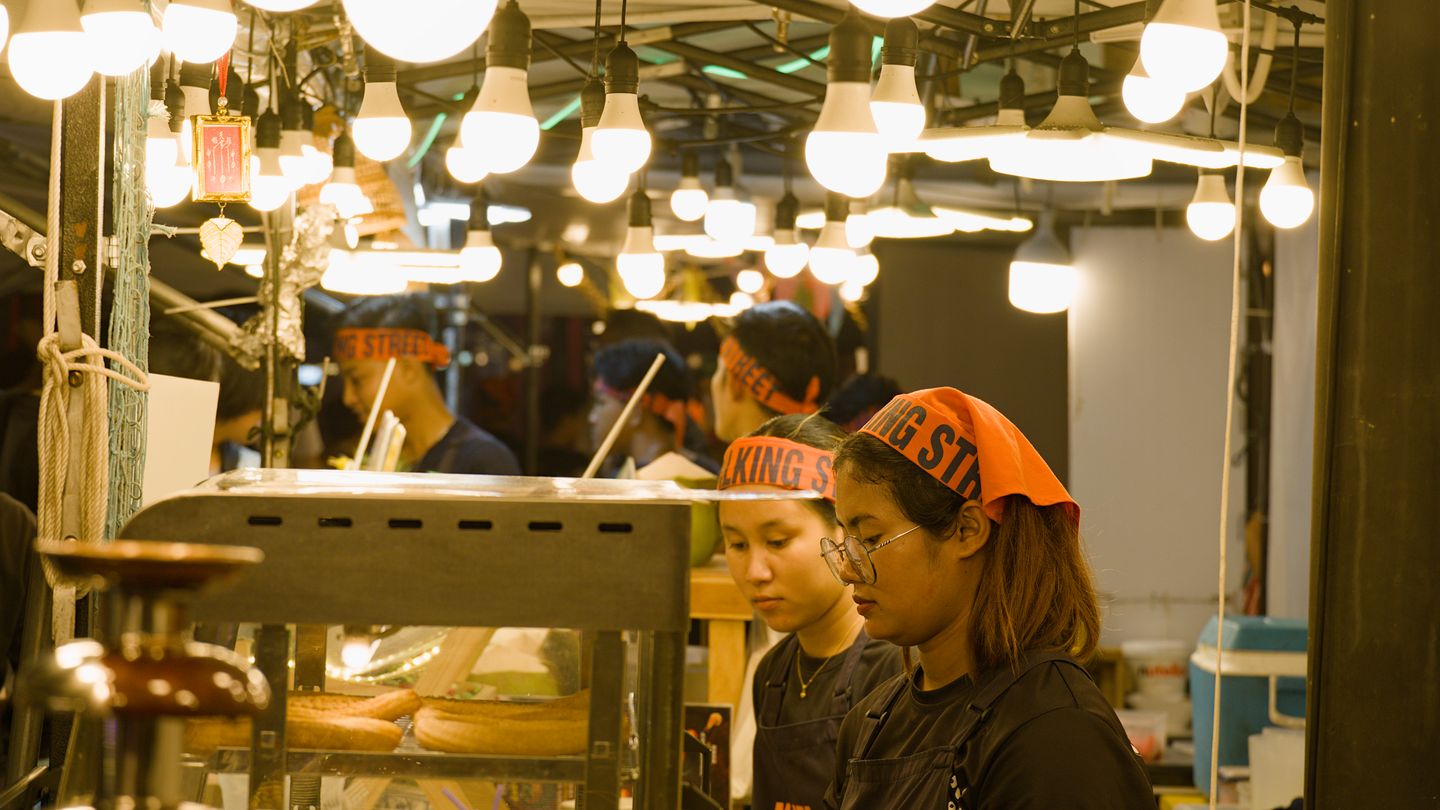 Busy night market with hundreds of lights